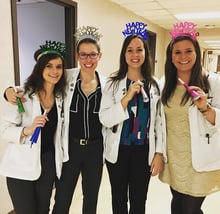 Members of The Ohio State University College of Optometry class of 2017, from left, Taylor McGann, Caitlin Walker, Chelsea Monroe and Elizabeth Brubaker, create a festive mood in clinic on New Year’s Eve.