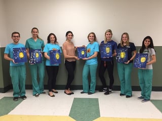 Third-year NSU student Jeremy Outinen, left, and the Vision Rehabilitation Club participated in a Paint Night. They used low-vision goggles to simulate different kinds of visual impairments such as age-related macular degeneration, glaucoma and scotoma.