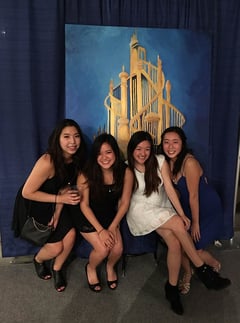 Mina Choi (far right), first-year student at University of California – Berkeley School of Optometry, with friends at the 2016 EyeBall semi-formal. The four of them painted the mural behind them.