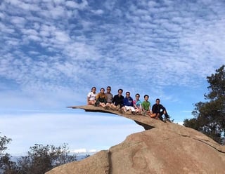 Members of UCSD Insight Pre-Optometry Club hiking at Potato Chip Rock in San Diego