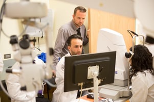 Students and faculty at the University of the Incarnate Word Rosenberg School of Optometry’s Bowden Eye Care and Health Center review optical coherence tomography results.