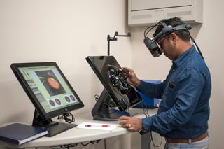 Gaining experience in the virtual reality lab, South India Sales Manager, Vijay Babu, searches for shapes hidden within the retina.